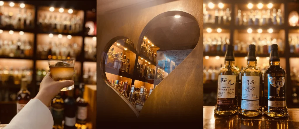 The heart-shaped window at Bar Little Happiness, with Hiroshima whisky Sakurao on display