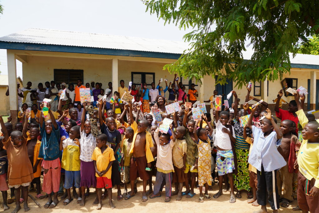 Mika Tanimoto with villagers at the opening of the health clinic she donated in Ghana, 2012