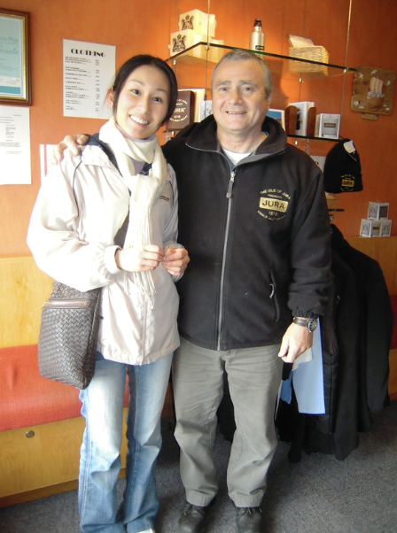 Mika Tanimoto visiting Jura Distillery in Scotland, with a member of the distillery staff