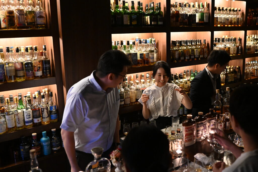 Ian Chang of Komoro Distillery pouring new-born spirit at a tasting in Hiroshima